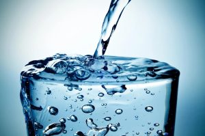 Tucson Water Softener helps quality of water image shows water being poured into glass