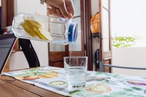 Use an Apache Junction Non-Salt Water Softener from H2O Concepts and enjoy energy efficiency image shows water being poured into glass