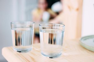 Get cleaner water for your home with a Queen Creek Non-Salt Water Softener. Image shows glasses of water.